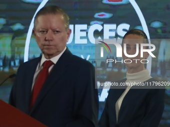 Mexico's President Claudia Sheinbaum Pardo is seen in the background while Arturo Zaldivar Lelo de Larrea, Coordinator of Policy and Governm...