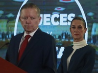 Mexico's President Claudia Sheinbaum Pardo is seen in the background while Arturo Zaldivar Lelo de Larrea, Coordinator of Policy and Governm...