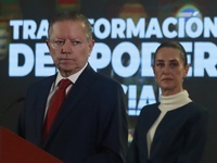 Mexico's President Claudia Sheinbaum Pardo is seen in the background while Arturo Zaldivar Lelo de Larrea, Coordinator of Policy and Governm...