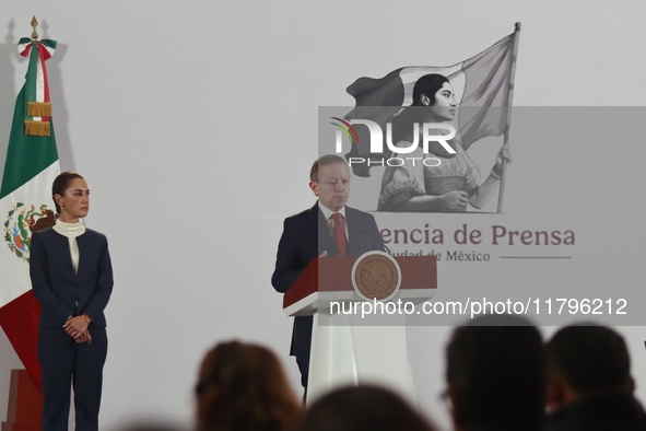 Mexico's President Claudia Sheinbaum Pardo is seen in the background while Arturo Zaldivar Lelo de Larrea, Coordinator of Policy and Governm...