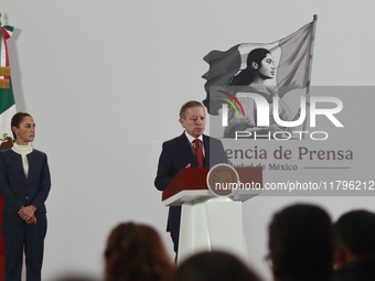 Mexico's President Claudia Sheinbaum Pardo is seen in the background while Arturo Zaldivar Lelo de Larrea, Coordinator of Policy and Governm...