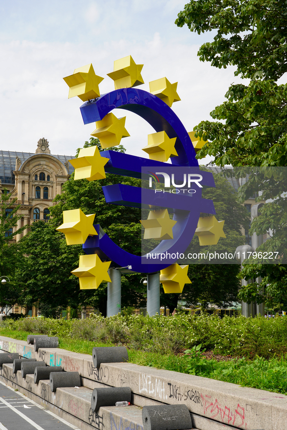 The artwork features a monumental blue Euro sign encircled by twelve yellow stars and embodies the colors and spirit of the European Union....