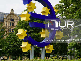 The artwork features a monumental blue Euro sign encircled by twelve yellow stars and embodies the colors and spirit of the European Union....