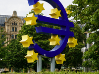 The artwork features a monumental blue Euro sign encircled by twelve yellow stars and embodies the colors and spirit of the European Union....