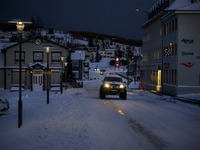 A car moves along one of the main streets in Husavik, Iceland, on November 19, 2024. (