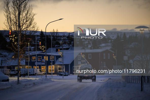 A car moves along one of the main streets in Husavik, Iceland, on November 19, 2024. 