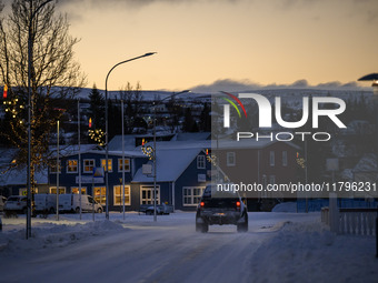 A car moves along one of the main streets in Husavik, Iceland, on November 19, 2024. (