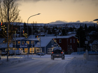 A car moves along one of the main streets in Husavik, Iceland, on November 19, 2024. (