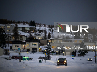 A car moves along one of the main streets in Husavik, Iceland, on November 19, 2024. (