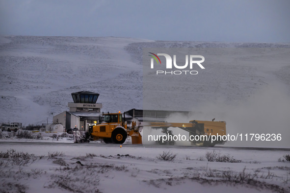 A snowplow clears the landing strip at the airfield in the town of Husavik, Iceland, on November 19, 2024. 