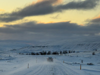 A car drives on one of the roads around the town of Husavik, Iceland, on November 19, 2024. (