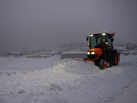 A snowplow cleans the streets in the town of Husavik, Iceland, on November 19, 2024. (