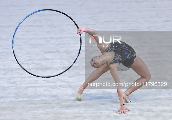 Habiba Aly of Egypt performs the Hoop exercise during the International Rhythmic Gymnastics Tournament ''Sky Grace 2024'' at Aspire Zone Fou...