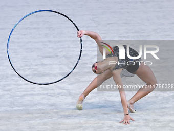 Habiba Aly of Egypt performs the Hoop exercise during the International Rhythmic Gymnastics Tournament ''Sky Grace 2024'' at Aspire Zone Fou...