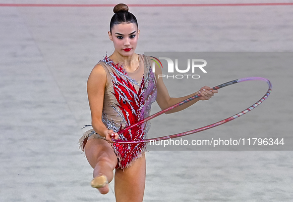 Andela Mazibrada of Serbia performs the Hoop exercise during the International Rhythmic Gymnastics Tournament ''Sky Grace 2024'' at Aspire Z...