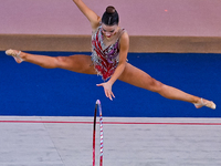 Andela Mazibrada of Serbia performs the Hoop exercise during the International Rhythmic Gymnastics Tournament ''Sky Grace 2024'' at Aspire Z...