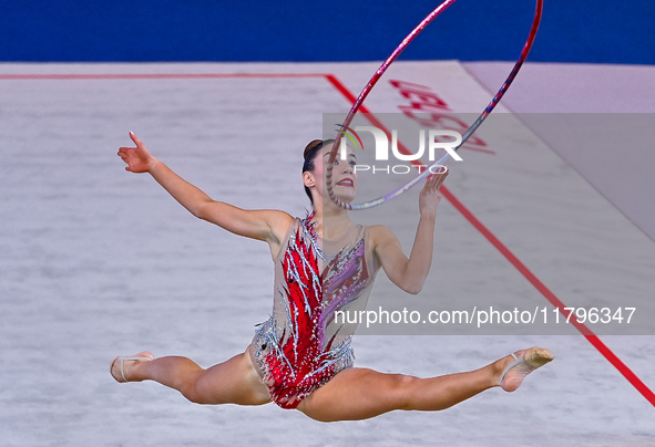 Andela Mazibrada of Serbia performs the Hoop exercise during the International Rhythmic Gymnastics Tournament ''Sky Grace 2024'' at Aspire Z...