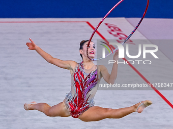 Andela Mazibrada of Serbia performs the Hoop exercise during the International Rhythmic Gymnastics Tournament ''Sky Grace 2024'' at Aspire Z...