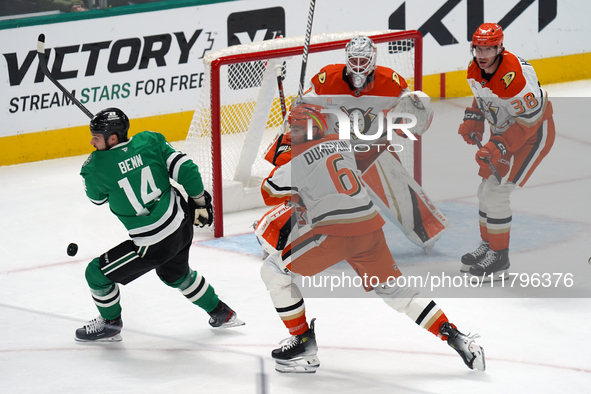 Jamie Benn #14 of the Dallas Stars and Brian Dumoulin #6 of the Anaheim Ducks battle for the puck during the NHL regular season match at the...