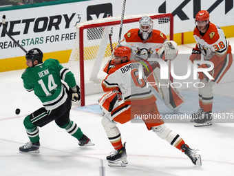 Jamie Benn #14 of the Dallas Stars and Brian Dumoulin #6 of the Anaheim Ducks battle for the puck during the NHL regular season match at the...