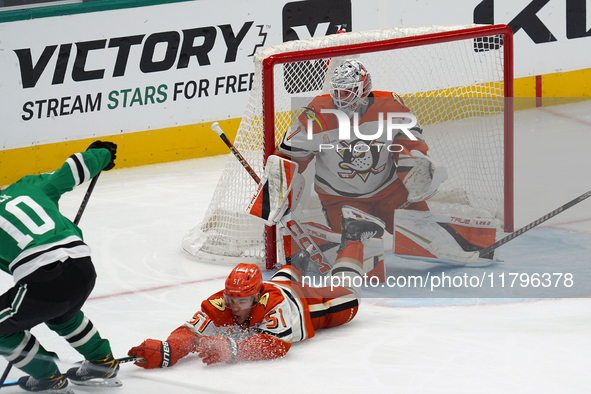 Olen Zellweger #51 of the Anaheim Ducks slides on the ice trying to make a defensive play against the Dallas Stars during the NHL regular se...