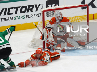 Olen Zellweger #51 of the Anaheim Ducks slides on the ice trying to make a defensive play against the Dallas Stars during the NHL regular se...