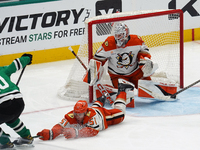 Olen Zellweger #51 of the Anaheim Ducks slides on the ice trying to make a defensive play against the Dallas Stars during the NHL regular se...