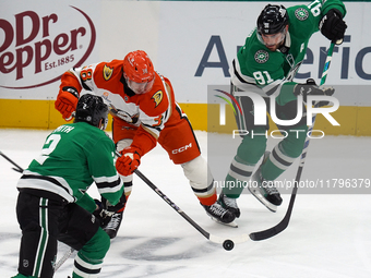 Jansen Harkins #38 of the Anaheim Ducks battles for the puck against the Dallas Stars during the NHL regular season match at the American Ai...