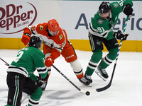 Jansen Harkins #38 of the Anaheim Ducks battles for the puck against the Dallas Stars during the NHL regular season match at the American Ai...