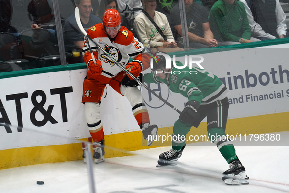 Wyatt Johnston #53 of the Dallas Stars and Jackson LaCombe #2 of the Anaheim Ducks battle for the puck during the NHL regular season match a...