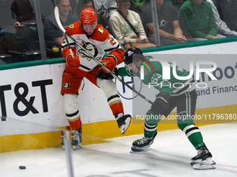 Wyatt Johnston #53 of the Dallas Stars and Jackson LaCombe #2 of the Anaheim Ducks battle for the puck during the NHL regular season match a...