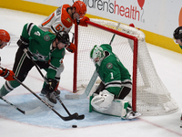 Miro Heiskanen #4 and Goalie Casey DeSmith #1 of the Dallas Stars defend the goal against the Anaheim Ducks during the NHL regular season ma...