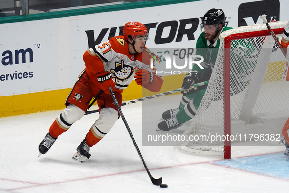 Olen Zellweger #51 of the Anaheim Ducks skates on the ice with the puck against the Dallas Stars during the NHL regular season match at the...