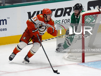 Olen Zellweger #51 of the Anaheim Ducks skates on the ice with the puck against the Dallas Stars during the NHL regular season match at the...