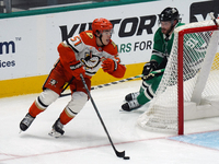 Olen Zellweger #51 of the Anaheim Ducks skates on the ice with the puck against the Dallas Stars during the NHL regular season match at the...