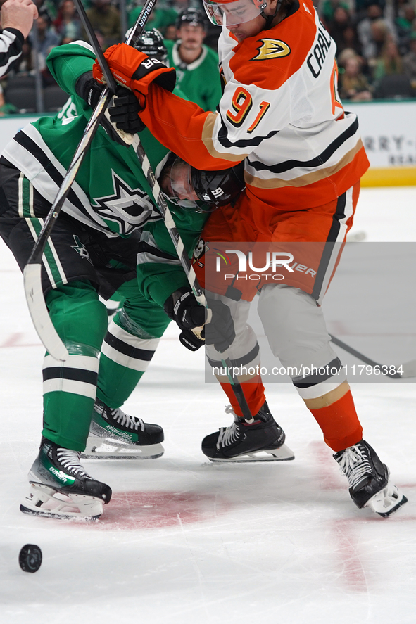 Tyler Seguin #91 of the Dallas Stars and Leo Carlsson #91 of the Anaheim Ducks battle for the puck during the NHL regular season match at th...