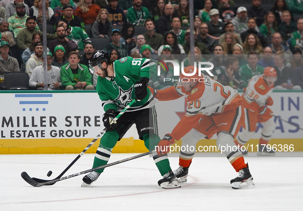 Tyler Seguin #91 of the Dallas Stars and Brett Leason #20 of the Anaheim Ducks battle for the puck during the NHL regular season match at th...