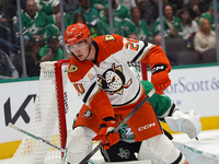 Brett Leason #20 of the Anaheim Ducks controls the puck against the Dallas Stars during the NHL regular season match at the American Airline...