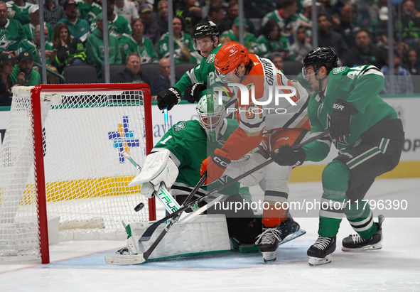 Cutter Gauthier #61 of the Anaheim Ducks puts the puck in the goal against goalie Casey DeSmith #1 of the Dallas Stars during the NHL regula...