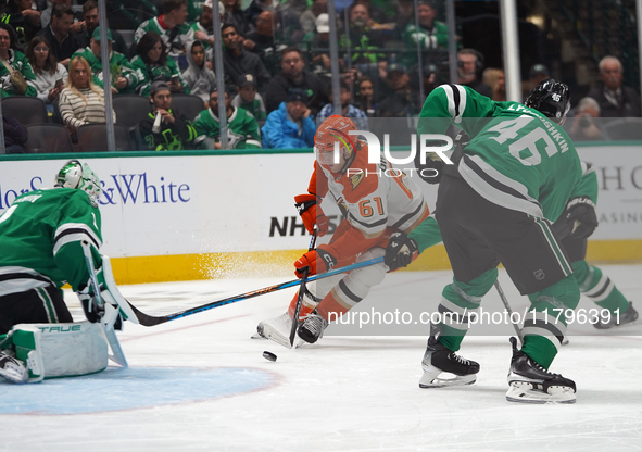 Cutter Gauthier #61 of the Anaheim Ducks skates with the puck against the Dallas Stars during the NHL regular season match at the American A...