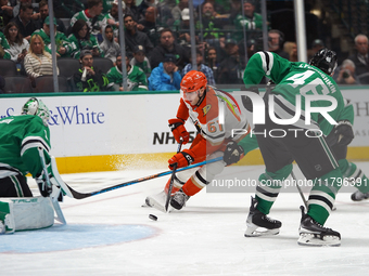 Cutter Gauthier #61 of the Anaheim Ducks skates with the puck against the Dallas Stars during the NHL regular season match at the American A...