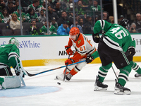 Cutter Gauthier #61 of the Anaheim Ducks skates with the puck against the Dallas Stars during the NHL regular season match at the American A...