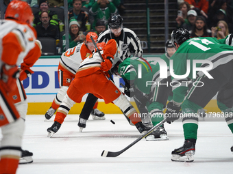 Wyatt Johnston #53 of the Dallas Stars battles for the puck against the Anaheim Ducks during the NHL regular season match at the American Ai...