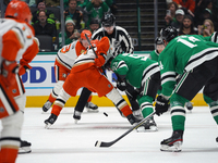 Wyatt Johnston #53 of the Dallas Stars battles for the puck against the Anaheim Ducks during the NHL regular season match at the American Ai...