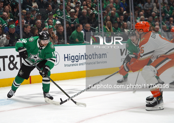 Sam Steel #18 of the Dallas Stars competes for the puck against Brian Dumoulin #6 of the Anaheim Ducks during the NHL regular season match a...