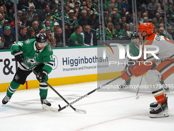 Sam Steel #18 of the Dallas Stars competes for the puck against Brian Dumoulin #6 of the Anaheim Ducks during the NHL regular season match a...