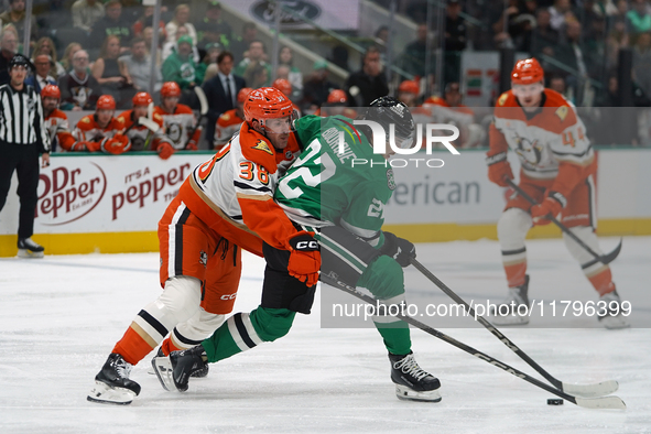 Jansen Harkins #38 of the Anaheim Ducks tries to get the puck from Mavrik Bourque #22 of the Dallas Stars during the NHL regular season matc...