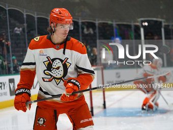 Trevor Zegras #11 of the Anaheim Ducks plays with the puck against the Dallas Stars during the NHL regular season match at the American Airl...