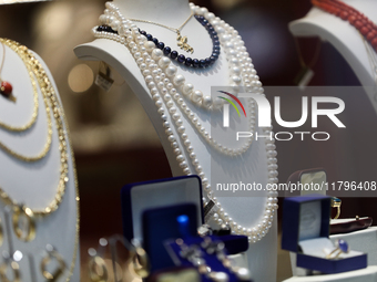 Jewelry is displayed in a store window on the street in Krakow, Poland, on November 18, 2024. (