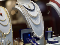 Jewelry is displayed in a store window on the street in Krakow, Poland, on November 18, 2024. (